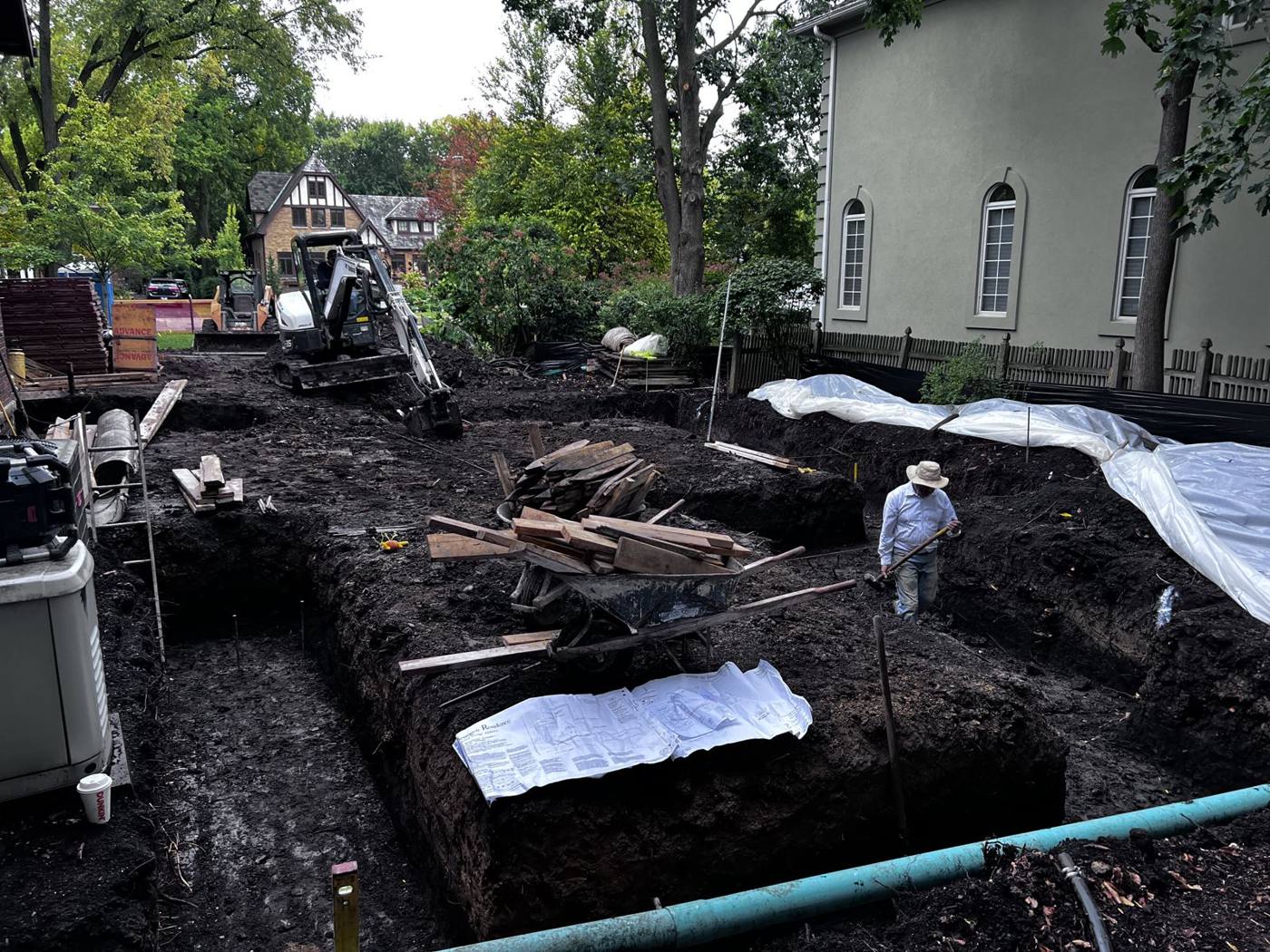 Footing trenches dug between the house and the neighbor's house