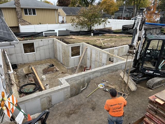 Stripped full height foundation walls with window openings