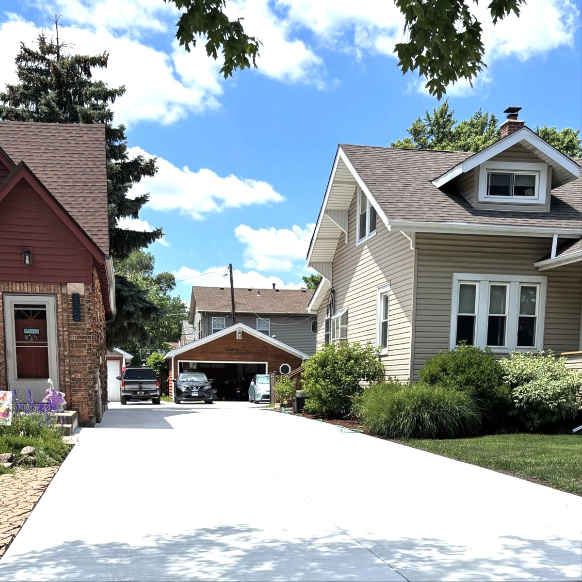 A freshly poured concrete driveway shared between two neighboring homes in DuPage County