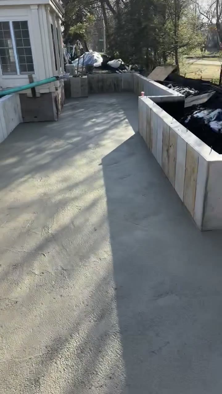 Placing six-bag concrete on a room-addition foundation